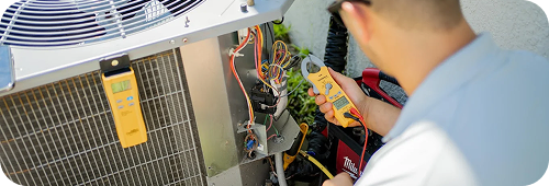 Technician tuning up AC unit